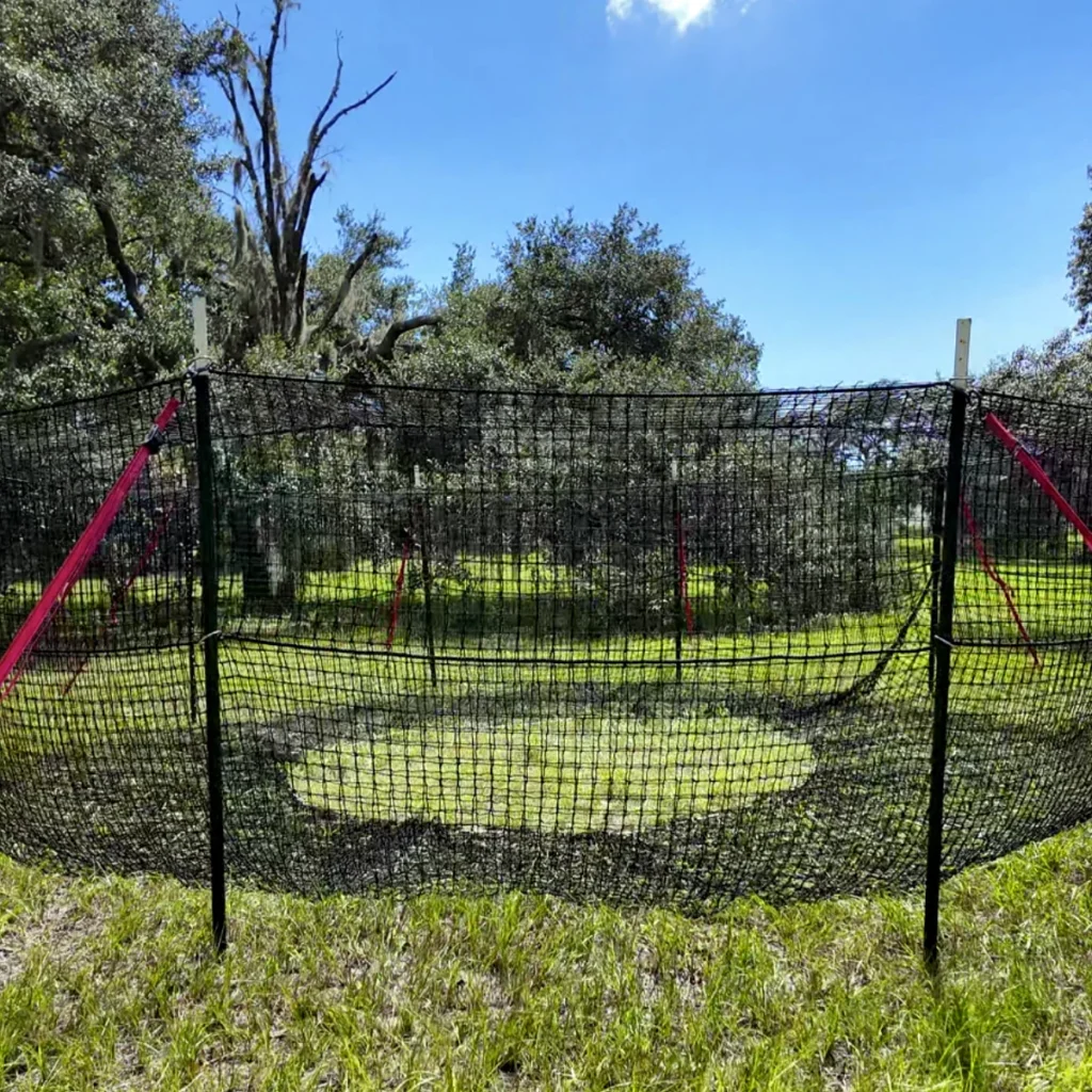 1:1 square centered view of The P.I.G. Hog Trap™ at ground level, showcasing a professional feral hog trapping system designed for complete sounder removal, feral hog control, and long-term feral swine management.