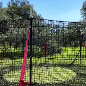 9:16 vertical medium-close view of The P.I.G. Hog Trap™ at ground level, showcasing a complete wild hog trapping system engineered for feral hog control, complete sounder removal, and long-term feral swine management.
