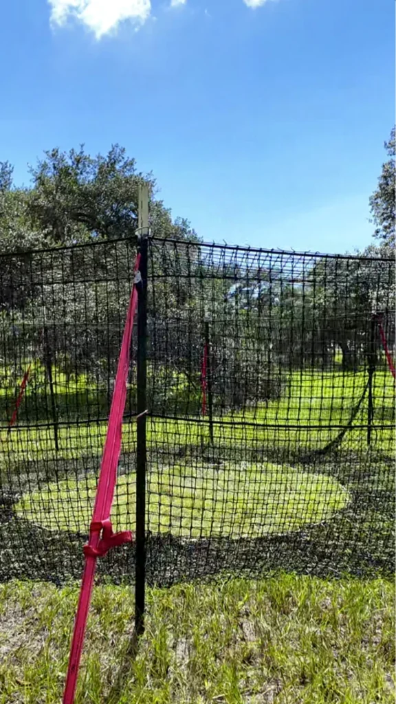 9:16 vertical medium-close view of The P.I.G. Hog Trap™ at ground level, showcasing a complete wild hog trapping system engineered for feral hog control, complete sounder removal, and long-term feral swine management.